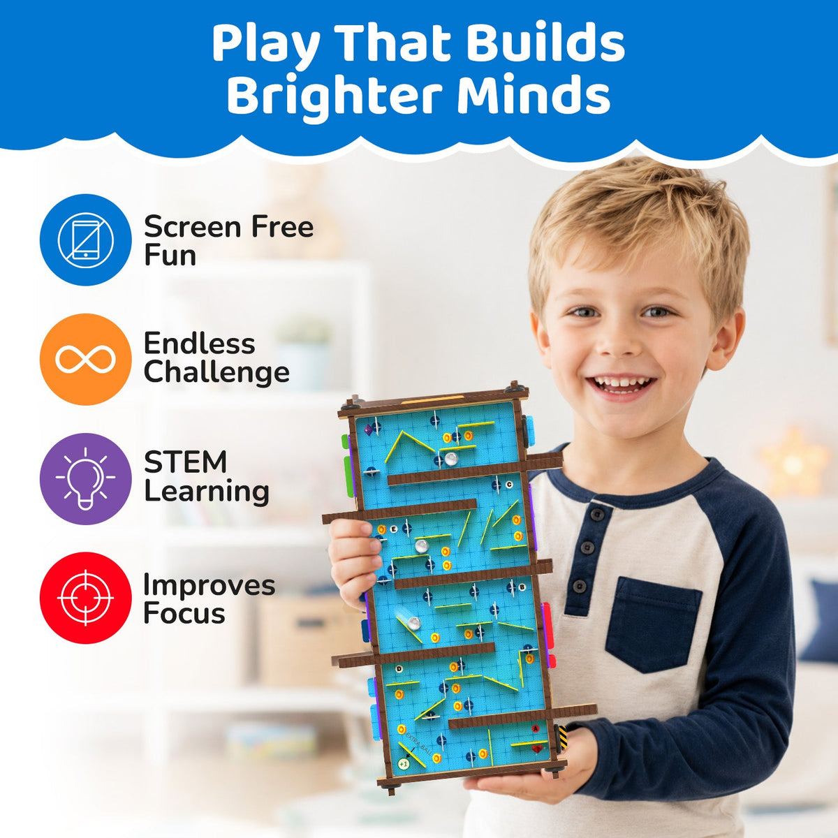 Smiling boy holding the second side of the built double-sided Slide Maze