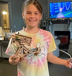Girl holding her Hydraulic Plane Launcher build
